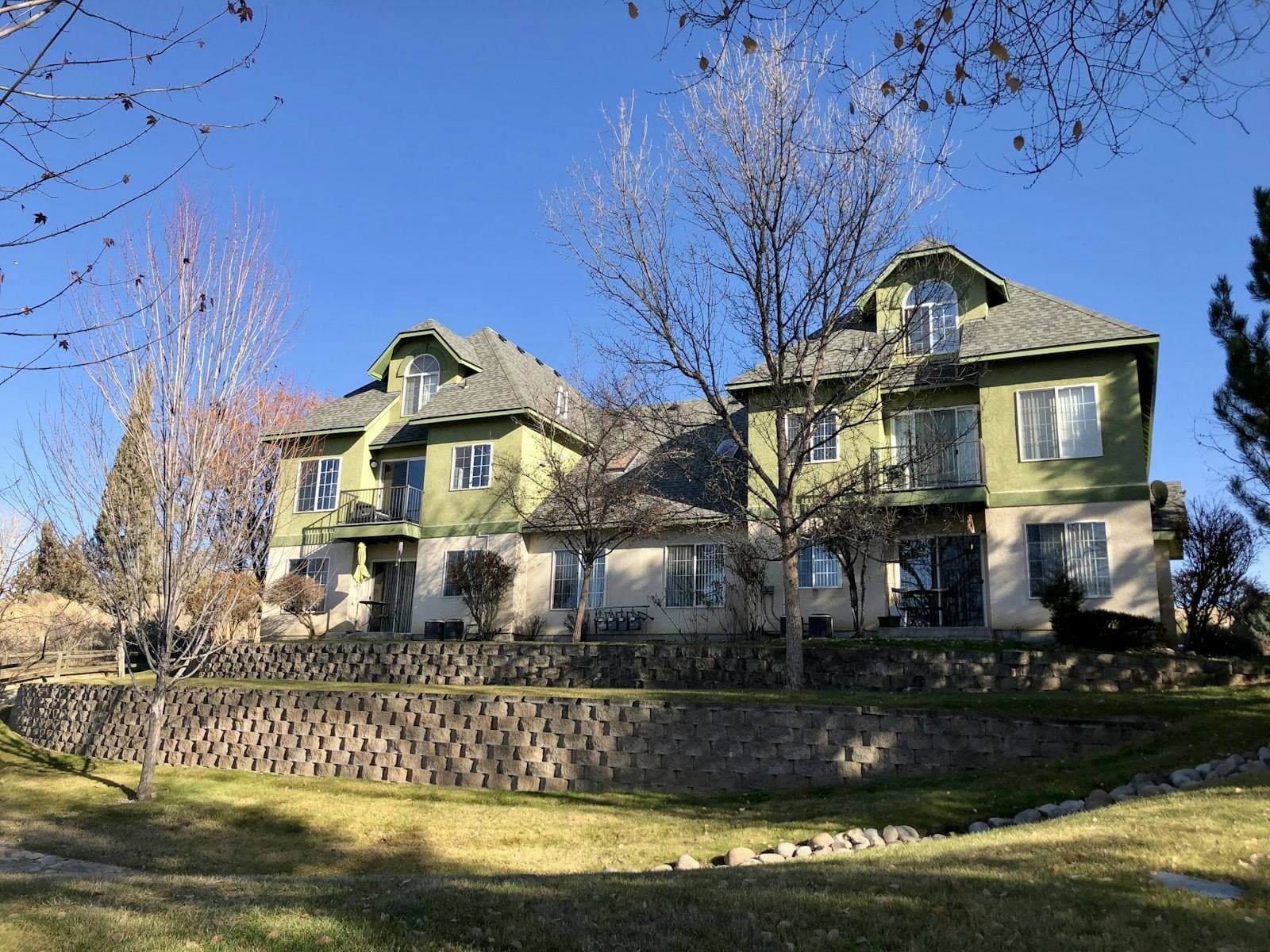 Large Idaho home with stone wall landscaping. Ada County appeal guide.
