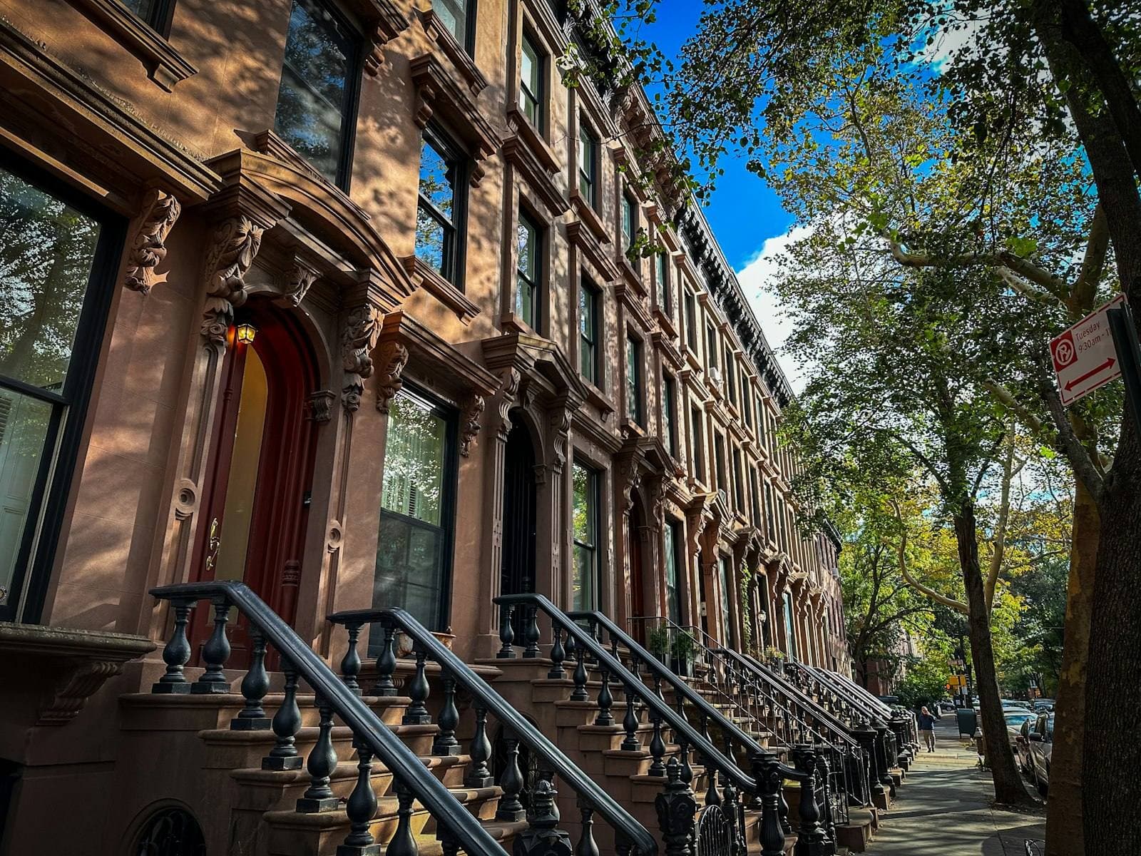 Row of classic New York brownstones. Onondaga County grievance guide.
