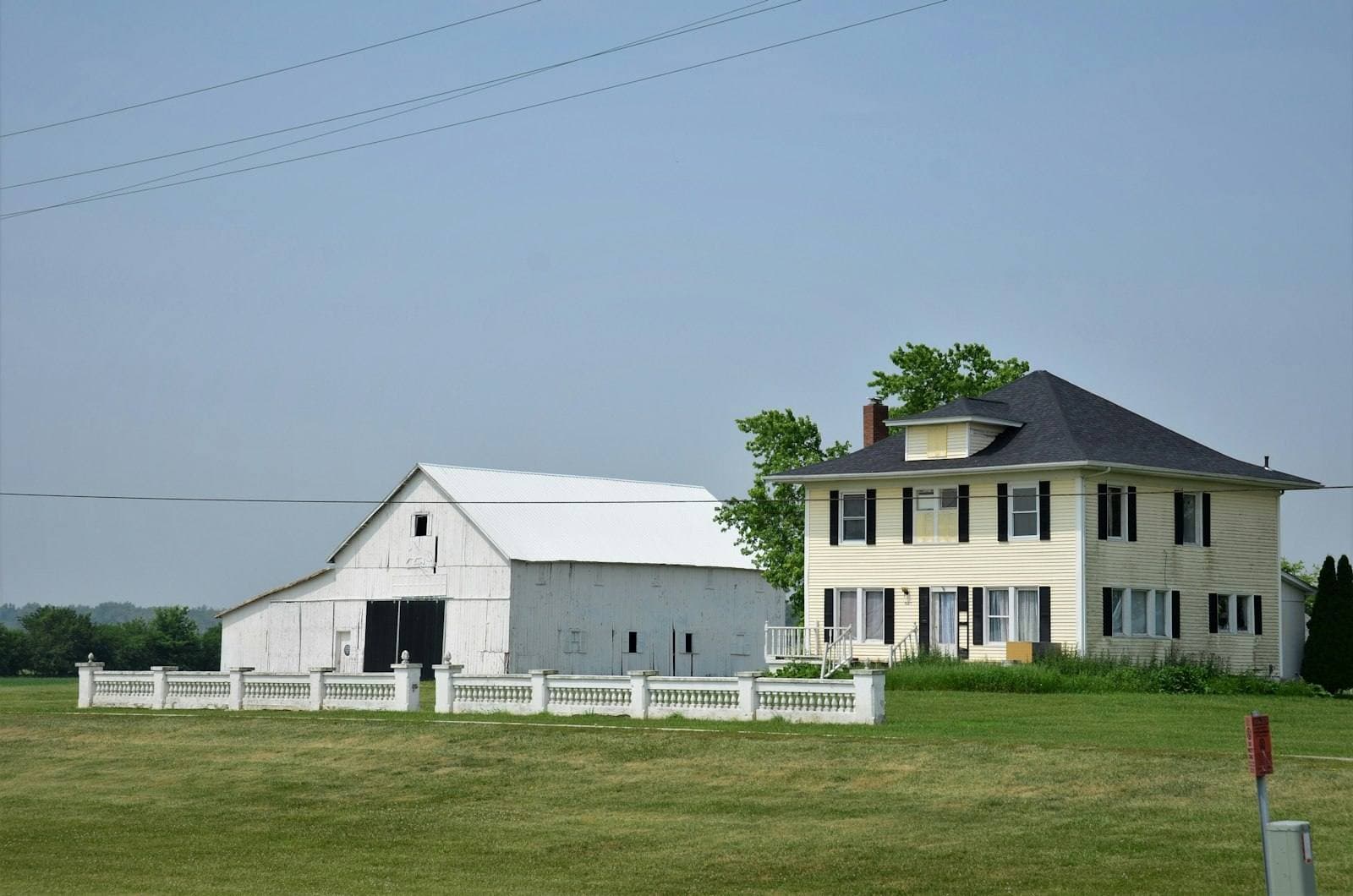 White Oklahoma home on open green land